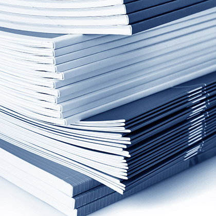 pile of color magazines isolated on white background